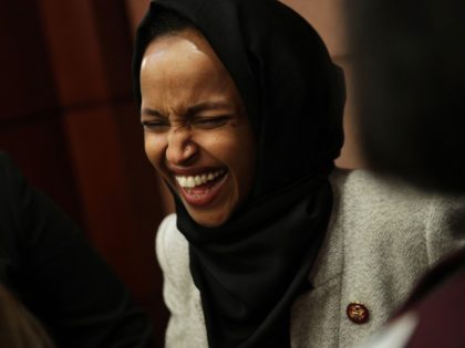 U.S. Rep. Ilhan Omar (D-MN) is seen after a news conference February 12, 2019 on Capitol Hill in Washington, DC. U.S. Sen. Kirsten Gillibrand (D-NY) and Rep. Rosa DeLauro (D-CT) held a news conference to introduce the 'Family and Medical Insurance Leave Act,' or FAMILY Act. (Photo by Alex Wong/Getty …