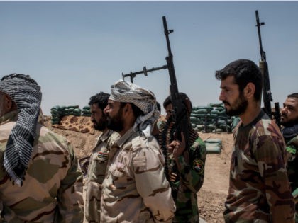Iraqi PMF fighters June 20, 2017 on the Iraq-Syria border in Nineveh, Iraq.