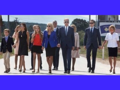 “Members of the Biden family cross the highway to a dedication ceremony for a road that