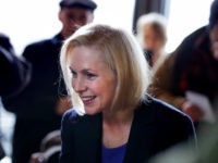 Kirsten-Gillibrand-patrons-New-Hampshire-ap Sen. Kirsten Gillibrand, D-NY, smiles as she listens to a patron while visiting a coffee shop on Main Street in Concord, N.H., Friday, Feb. 15, 2019. Gillibrand visited New Hampshire as she explores a 2020 run for president. (AP Photo/Charles Krupa)