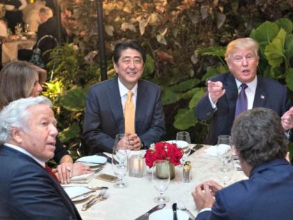 President Donald Trump, Japanese Prime Minister Shinzo Abe (2nd-L), his wife Akie Abe (R), US First Lady Melania Trump (L) and Robert Kraft (2nd-L),owner of the New England Patriots, sit down for dinner at Trump's Mar-a-Lago resort on February 10, 2017. Photograph by Nicholas Kamm—AFP/Getty Images