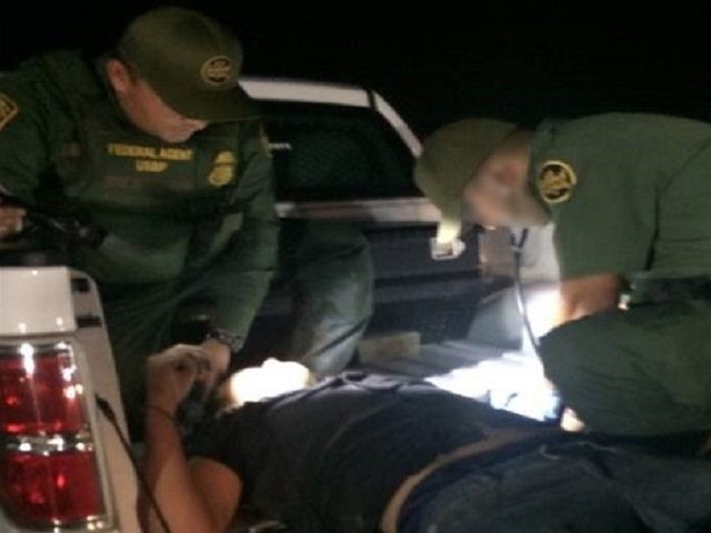 Laredo Sector Border Patrol agents administer medical assistance after rescuing a lost migrant on a ranch near Hebbronville, Texas. (Photo: U.S. Border Patrol/Laredo Sector)