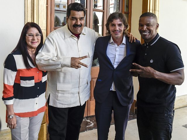 Venezuelan President Nicolas Maduro (2-L) and Venezuelan First Lady Cilia Flores (L) pose