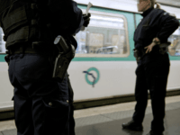 TO GO WITH AFP STORY BY CYRIL TROUAUX Policemen from a brigade in charge of Paris transport network stand on the platform during a patrol in a Paris subway station on April 27, 2014. Policemen focus on offenders known to target sleeping partygoers on their way home at dawn, who …