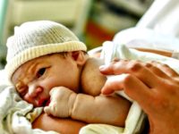 Newborn Baby A newborn lies on his mother's stomach after a delivery at the medical clinic St Vincent de Paul in Lille, on Aug. 17, 2018. (Philippe Huguen/AFP/Getty Images)