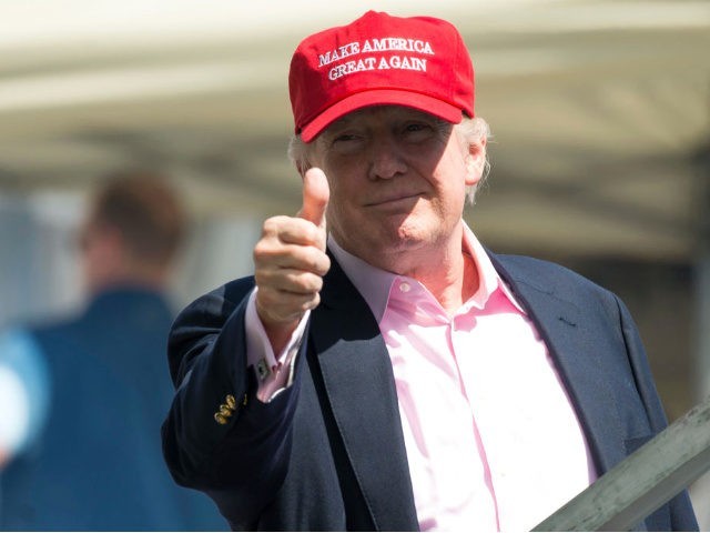 US President Donald Trump gives a thumbs-up well wishers as he arrives at the 72nd US Women's Open Golf Championship at Trump National Golf Course in Bedminster, New Jersey, July 16, 2017.