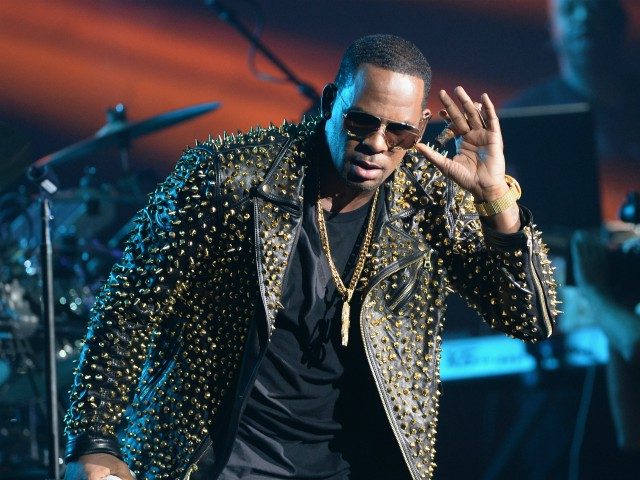 LOS ANGELES, CA - JUNE 30: Singer R. Kelly performs onstage during the 2013 BET Awards at