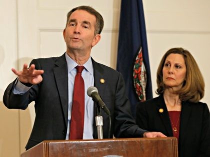 Virginia Gov. Ralph Northam, left, gestures as his wife, Pam, listens during a news conference in the Governors Mansion at the Capitol in Richmond, Va., Saturday, Feb. 2, 2019. Northam is under fire for a racial photo that appeared in his college yearbook.