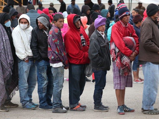 Migrants, most of whom are part of a recently arrived caravan, stand in line for breakfast at a migrant hostel as they wait to apply for asylum into the United States on February 08, 2019 in Piedras Negras, Mexico. The hostel is holding approximately 2,000 migrants from Honduras, Guatemala and …