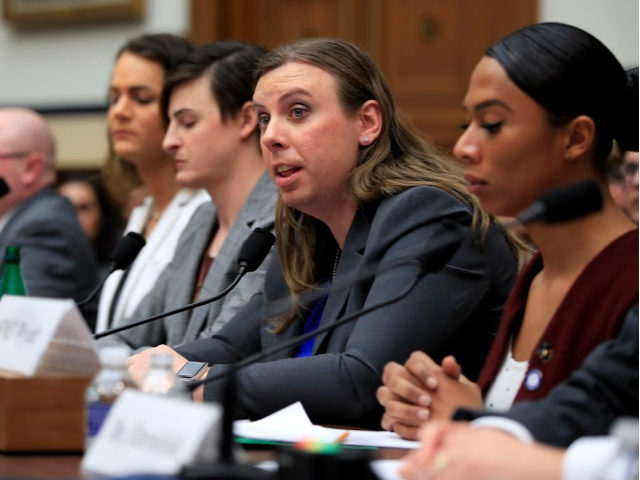 Army Staff Sgt. Patricia King, second from right, together with other transgender military members, from left, Navy Lt. Cmdr. Blake Dremann, Army Capt. Alivia Stehlik, Army Capt. Jennifer Peace and Navy Petty Officer Third Class Akira Wyatt, testify about their military service before a House Armed Services Subcommittee on Military …