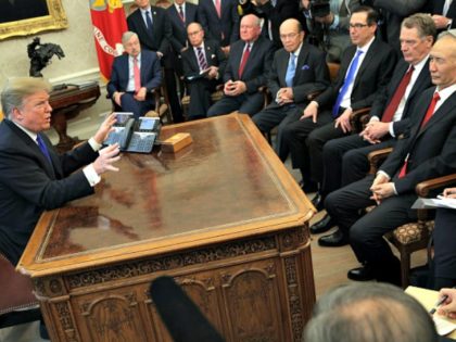 WASHINGTON, DC - FEBRUARY 22: U.S. President Donald Trump (L) speaks during a meeting with Chinese Vice Premier Liu He (R) as other U.S. officials look on in the Oval Office of the White House February 22, 2019 in Washington, DC. Liu is in Washington with the Chinese delegation to participate …