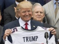 Trump Patriots jersey (Saul Loeb / AFP / Getty) Trump Patriots jersey (Saul Loeb / AFP / Getty)