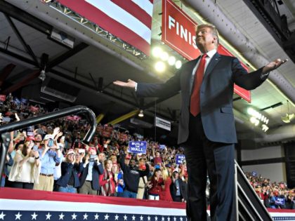 President Donald Trump gestures to the crowd as he speaks during a rally in El Paso, Texas