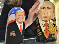 An employee at a Moscow gift shop polishes traditional Russian wooden nesting dolls depicting Donald Trump and Russian President Vladimir Putin. Alexander Nemenov/AFP/Getty Images