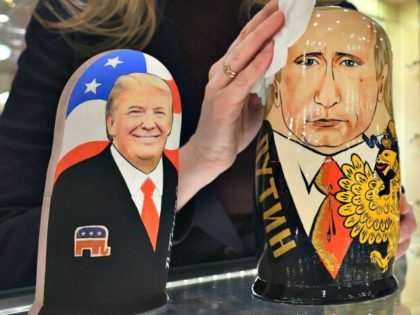 An employee at a Moscow gift shop polishes traditional Russian wooden nesting dolls depicting Donald Trump and Russian President Vladimir Putin. Alexander Nemenov/AFP/Getty Images