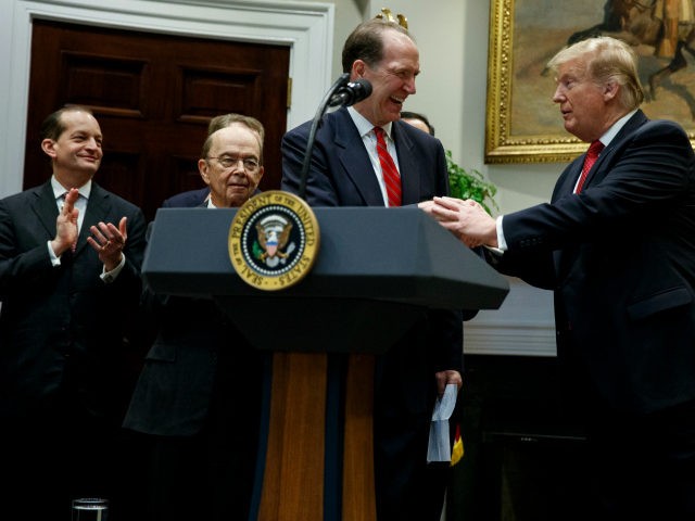 President Donald Trump shakes hands with his nominee to head the World Bank David Malpass,