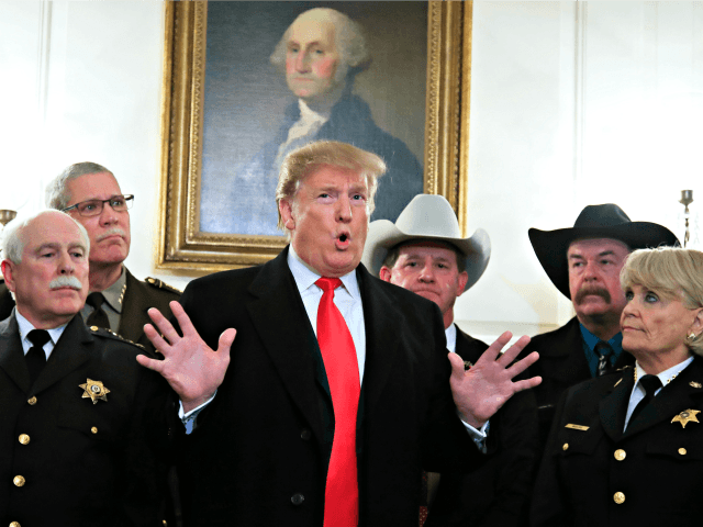 President Donald Trump speaks during a meeting with a group of sheriffs from around the co