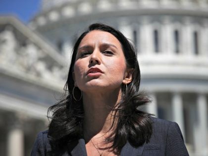 WASHINGTON, DC - JULY 18: Rep. Tulsi Gabbard (D-HI) speaks at a press conference on House Resolution 922 outside the U.S. Capitol July 18, 2018 in Washington, DC. Gabbard and Rep. Walter Jones (R-NC) spoke on reclaiming 'Congress's constitutional right to declare war' and efforts to define presidential wars not …