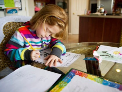 Autumn Watson does her homework in her dining room in Centreville, Maryland after class at Centreville Elementary on April 30, 2013.