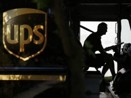 FILE - In this June 20, 2014, file photo, a United Parcel Service driver starts his truck after making a delivery in Cumming, Ga. UPS reports financial results on Friday, July 29, 2016. (AP Photo/David Goldman, File)