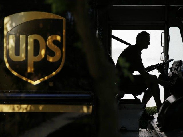 FILE - In this June 20, 2014, file photo, a United Parcel Service driver starts his truck