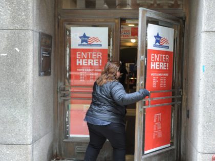 A voter enters a polling location in downtown Chicago for citywide mayoral elections on Fe