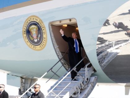 President Donald Trump waves while boarding Air Force One for a trip to Vietnam to meet with North Korean leader Kim Jong Un, Monday, Feb. 25, 2019, in Andrews Air Force Base, Md. (AP Photo/ Evan Vucci)