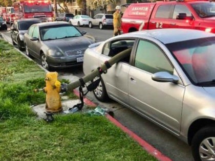 The Anaheim Fire & Rescue Department tweeted a photo on Tuesday of a car with its back window broken, a warning to drivers not to park near fire hydrants.