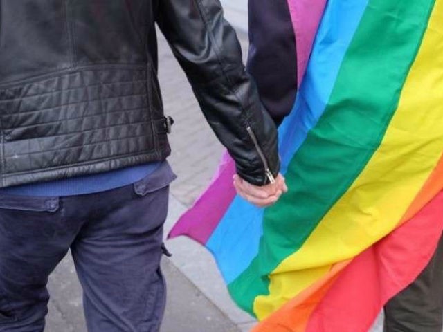 A couple hold hands as protesters march through the Dutch capital Amsterdam to show solidarity for two gay men who were badly beaten over the weekend in the eastern city of Arnhem, Wednesday, April 5, 2017. The peaceful match was part of a national outpouring of anger at the incident …