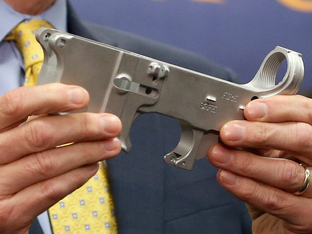 Benjamin Wagner, the United States Attorney for the Eastern District of California, displays a firearm part that can be used to make a untraceable assault-style weapon, during a news conference in Sacramento, Calif., Thursday, Oct. 15, 2015. Wagner announced that a federal grand jury indicted 8 men on a variety …