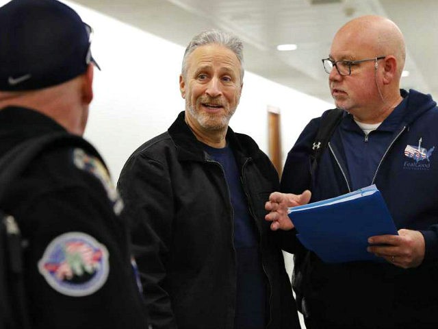 Entertainer and activist Jon Stewart, center, speaks with members of the FealGood Foundation as they arrive on Capitol Hill to speak with lawmakers about the compensation fund for victims of 9/11, Monday, Feb. 25, 2019, on Capitol Hill in Washington. Stewart has been involved in urging support for the first …