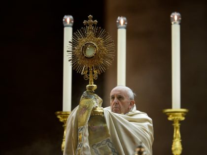 Pope Francis holds the monstrance during a mass in Saint Peter square at the Vatican on Se