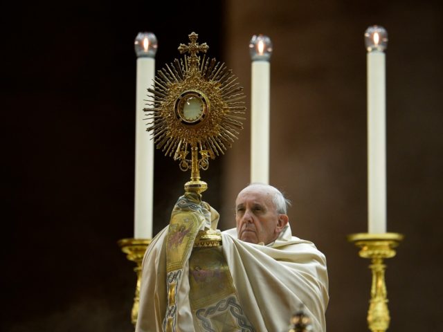 Pope Francis holds the monstrance during a mass in Saint Peter square at the Vatican on September 7, 2013. Pope Francis has called for a global day of fasting and prayer on Saturday for peace in Syria and against any armed intervention. AFP PHOTO / Filippo MONTEFORTE (Photo credit should …