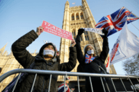 Pro-Brexit activists protest outside the Houses of Parliament in London on December 11, 2018. - British Prime Minister Theresa May began a humiliating European tour on Tuesday in a desperate bid to salvage her Brexit deal, a day after delaying a parliamentary vote on the text to avoid a crushing …