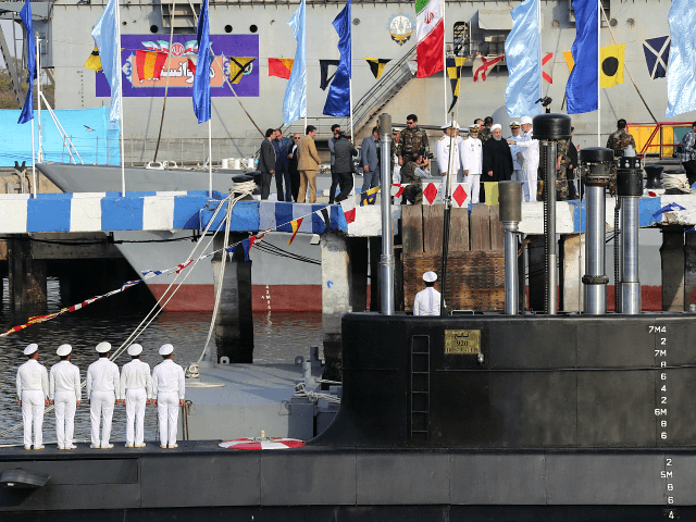 In this photo released by official website of the office of the Iranian Presidency, President Hassan Rouhani, center with white turban, and other dignitaries attend the inauguration of Fateh, "Conqueror" in Persian, Iranian made semi-heavy submarine in the southern port of Bandar Abbas, Iran, Sunday, Feb. 17, 2019. The Fateh …