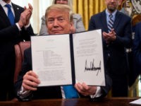 us-politics-trump-space-army US President Donald Trump shows his signature on the Space Policy Directive-4 (SPD-4) on February 19, 2019, at the White House in Washington, DC. - Trump, on June 18, 2018, directed the US Defense Department to establish a Space Force as the sixth branch of the Armed Forces. SPD-4 outlines …