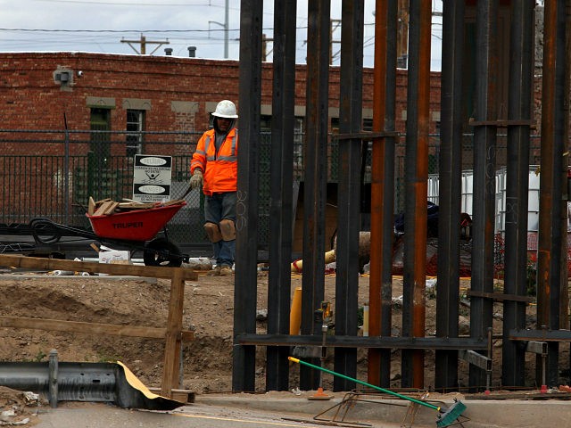 US workers build the border wall between El Paso, Texas, US and Ciudad Juarez, Mexico on F