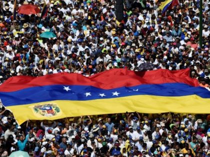 Rival rallies begin in tense Venezuela as air force general defects