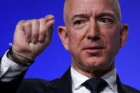 Amazon CEO Jeff Bezos, seen in a 2018 photo, decided to fight back following what he said was an extortion attempt by the National Enquirer, a supermarket tabloid controlled by a friend of President Donald Trump Bezos, world's richest man, shows won't be pushed around