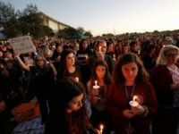 The Parkland survivors, pictured at a vigil the day after the massacre, rejected the usual outpourings of sympathy offered by politicians A year after US school massacre, gun control remains elusive