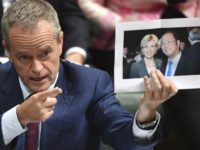Australia China Businessman Bill Shorten In this June 14, 2017, photo, leader of the opposition party Bill Shorten holds a photograph of Minister for Foreign Affairs Julie Bishop and Chinese businessman Huang Xiangmo during Question Time in the House of Representatives at Parliament House in Canberra, Australia. Australia has cancelled the residency of Huang but the foreign minister says she doesn't expect Beijing to protest. (Mick Tsikas/AAP Image via AP) The Associated Press