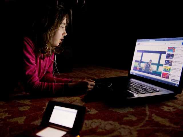 young girl watching YouTube videos