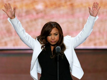 Lynne Patton of the Eric Trump Foundation waves during her speech during the third day of the Republican National Convention in Cleveland, Wednesday, July 20, 2016. (AP Photo/J. Scott Applewhite)