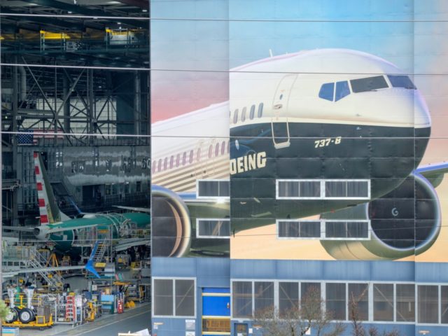 The Boeing 737-8 is pictured on a mural on the side of the Boeing Renton Factory on March 11, 2019 in Renton, Washington. Two of the aerospace company's newest model airliners have crashed in less than six months. (Photo by Stephen Brashear/Getty Images)
