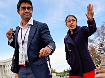 Rep.-elect Alexandria Ocasio-Cortez, D-NY., right, and her chief of staff Saikat Chakrabarti, left, walk back together after joining other members of the freshman class of Congress for a group photo on Capitol Hill in Washington, Wednesday, Nov. 14, 2018. (AP Photo/Pablo Martinez Monsivais)