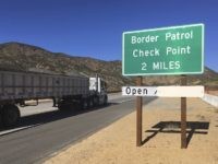 In this Thursday, Dec. 14, 2017 photo, a sign warns of the upcoming California Pine Valley checkpoint, on the main route from Arizona to San Diego. California legalizes marijuana for recreational use Jan. 1 but that won't stop federal agents from seizing small amounts on busy freeways and backcountry highways. …