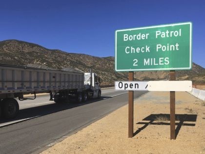 In this Thursday, Dec. 14, 2017 photo, a sign warns of the upcoming California Pine Valley checkpoint, on the main route from Arizona to San Diego. California legalizes marijuana for recreational use Jan. 1 but that won't stop federal agents from seizing small amounts on busy freeways and backcountry highways. …