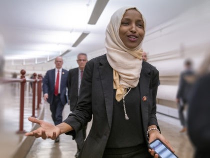 Rep. Ilhan Omar, D-Minn., walks to the chamber Thursday, March 7, 2019, on Capitol Hill in