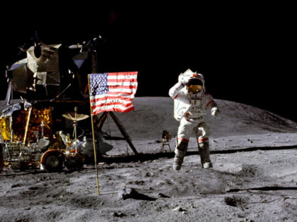 In this April 1972 photo made available by NASA, John Young salutes the U.S. flag at the D