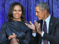 WASHINGTON, DC - FEBRUARY 12: Former U.S. President Barack Obama and first lady Michelle Obama participate in the unveiling of their official portraits during a ceremony at the Smithsonian's National Portrait Gallery, on February 12, 2018 in Washington, DC. The portraits were commissioned by the Gallery, for Kehinde Wiley to …